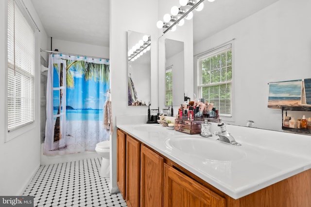 9525 Queens Guard Ct, Laurel, MD 20723 - bathroom featuring double vanity, toilet, and a shower
