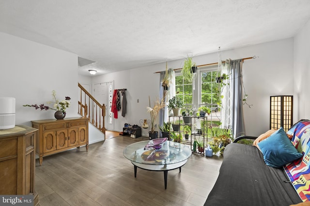 9525 Queens Guard Ct, Laurel, MD 20723 - living area featuring stairs, wood finished floors, and a textured ceiling