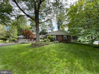 3004 Bluff Point Ln, Silver Spring, MD 20906 - view of grassy yard with asphalt driveway