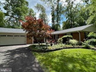 3004 Bluff Point Ln, Silver Spring, MD 20906 - ranch-style home featuring asphalt driveway, a garage, and a front yard