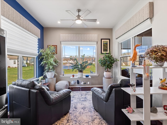living room with recessed lighting and a ceiling fan
