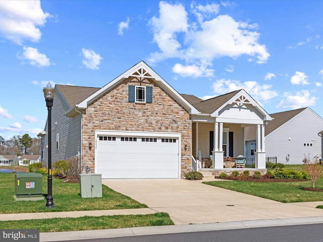 craftsman-style home featuring stone siding, concrete driveway, board and batten siding, a garage, and a porch