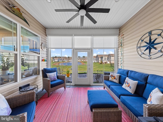 sunroom featuring outdoor lounge area and ceiling fan