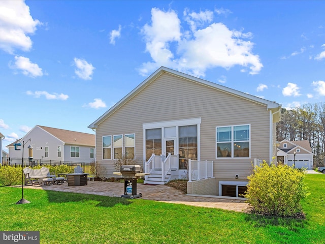 rear view of property featuring a patio area, fence, and a yard