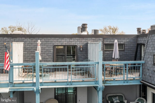 301 Burnside St Unit B 302, Annapolis, MD 21403 - rear view of property featuring outdoor dining area, a deck, and brick siding