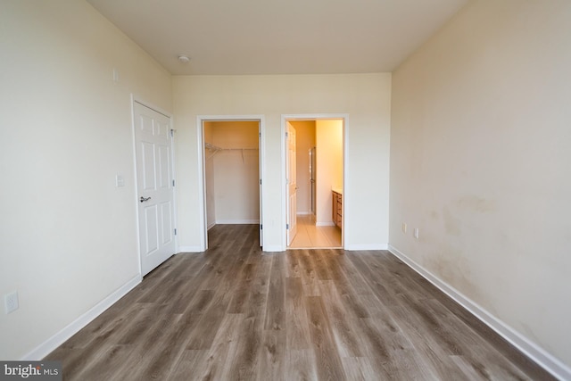 1144 Halifax Pl, Hamilton, NJ 08619 - unfurnished bedroom featuring a spacious closet, a closet, baseboards, and wood finished floors
