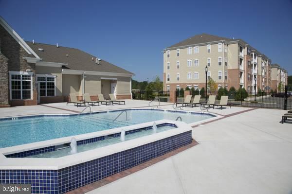 1144 Halifax Pl, Hamilton, NJ 08619 - pool with a hot tub, fence, and a patio area