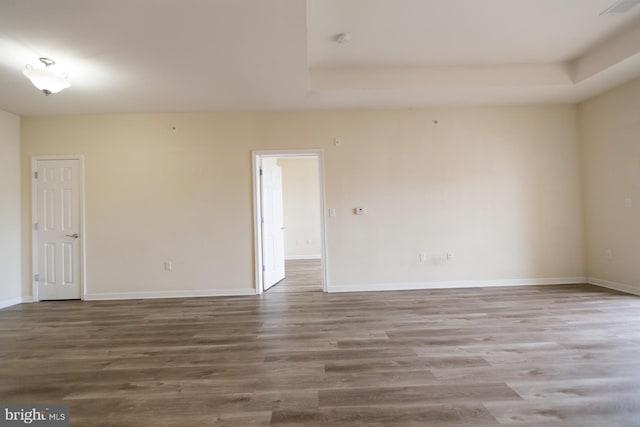 1144 Halifax Pl, Hamilton, NJ 08619 - spare room with baseboards, visible vents, a tray ceiling, and wood finished floors