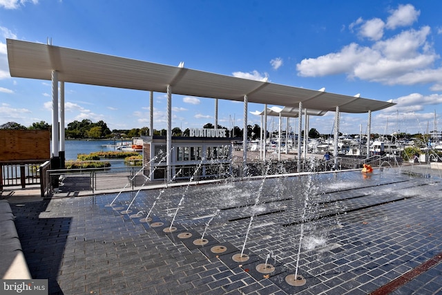 view of community with a water view