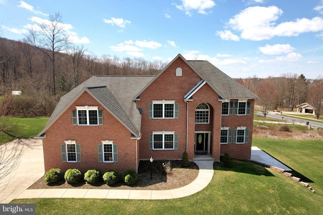 311 Treetops Dr, State College, PA 16801 - view of front facade featuring a front yard and brick siding