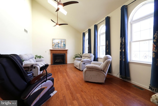 311 Treetops Dr, State College, PA 16801 - living area featuring a fireplace, visible vents, ceiling fan, lofted ceiling, and wood finished floors