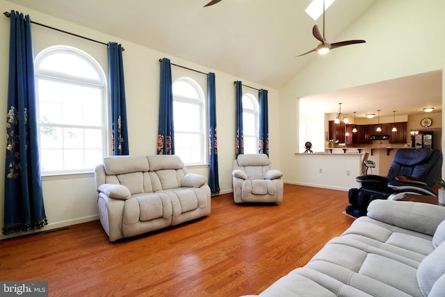 311 Treetops Dr, State College, PA 16801 - living area with ceiling fan with notable chandelier, wood finished floors, visible vents, and a healthy amount of sunlight