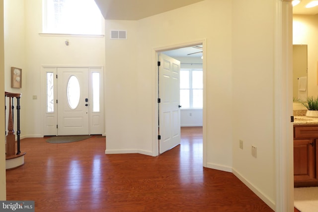 311 Treetops Dr, State College, PA 16801 - foyer with visible vents, baseboards, and dark wood-style floors
