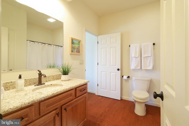311 Treetops Dr, State College, PA 16801 - full bath with vanity, a shower with curtain, toilet, wood finished floors, and baseboards