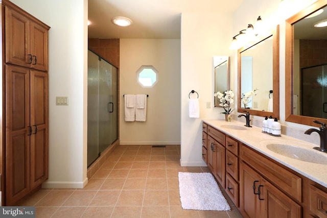 311 Treetops Dr, State College, PA 16801 - bathroom featuring a sink, tile patterned floors, double vanity, and a stall shower