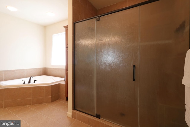311 Treetops Dr, State College, PA 16801 - bathroom with tile patterned floors, a stall shower, and a garden tub