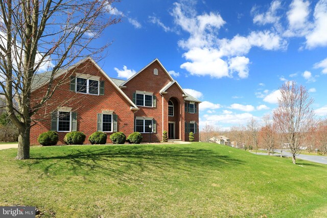 311 Treetops Dr, State College, PA 16801 - view of front of property featuring brick siding and a front yard