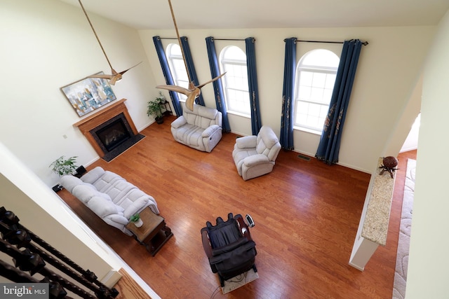 311 Treetops Dr, State College, PA 16801 - living area with wood finished floors, a fireplace, and visible vents