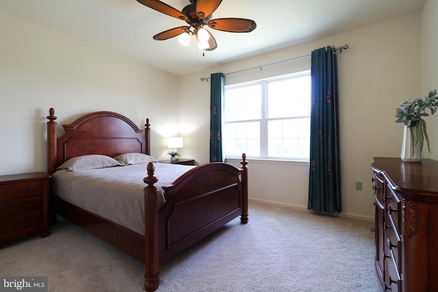311 Treetops Dr, State College, PA 16801 - bedroom featuring light carpet, baseboards, and a ceiling fan