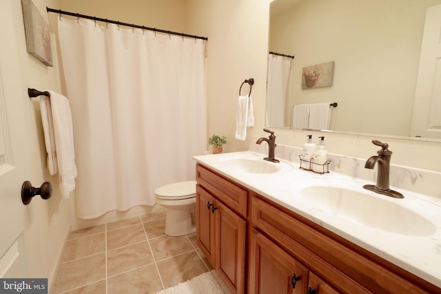 311 Treetops Dr, State College, PA 16801 - bathroom featuring a sink, tile patterned floors, toilet, and double vanity