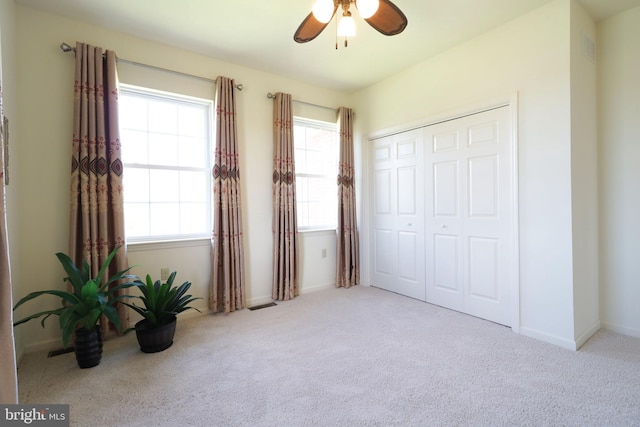 311 Treetops Dr, State College, PA 16801 - unfurnished bedroom featuring carpet flooring, visible vents, a closet, and a ceiling fan