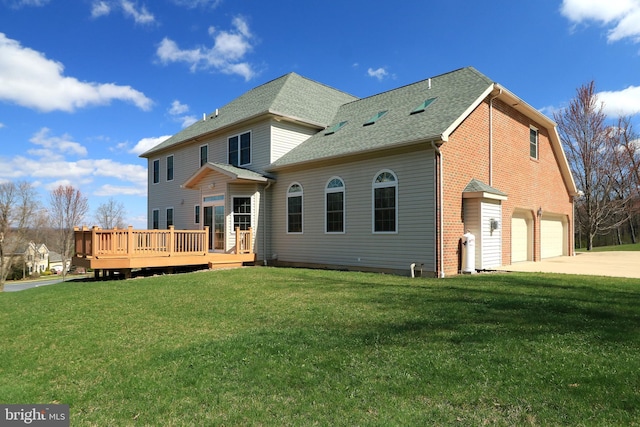 311 Treetops Dr, State College, PA 16801 - rear view of house featuring a wooden deck, a garage, a lawn, a shingled roof, and driveway