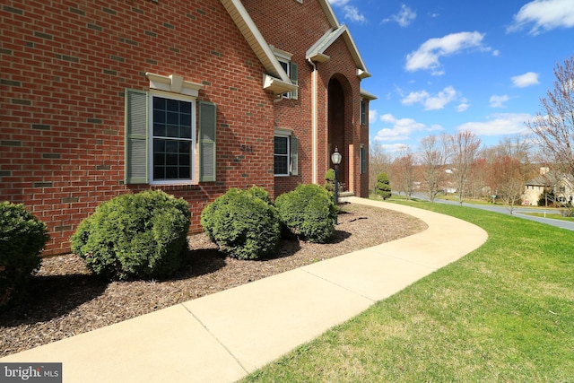 311 Treetops Dr, State College, PA 16801 - view of home's exterior featuring brick siding and a yard