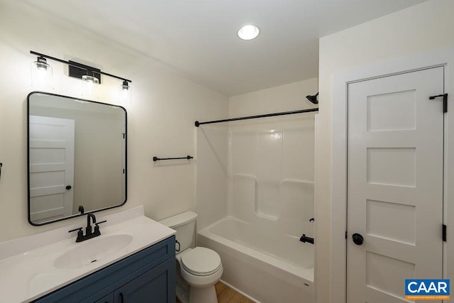 full bathroom featuring toilet, vanity, and shower / tub combination