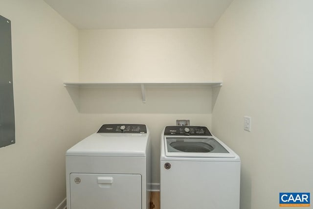 laundry room featuring baseboards, washing machine and clothes dryer, and laundry area