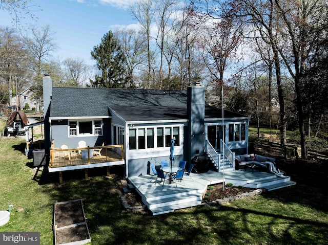 993 Hillendale Dr, Annapolis, MD 21409 - rear view of property featuring a shingled roof, a chimney, a wooden deck, and a sunroom