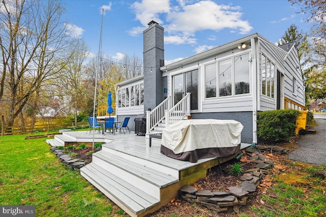 993 Hillendale Dr, Annapolis, MD 21409 - back of house featuring a chimney, a sunroom, a yard, and a deck
