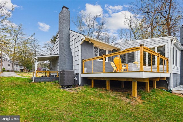 993 Hillendale Dr, Annapolis, MD 21409 - rear view of house featuring central air condition unit, a lawn, a chimney, and a wooden deck