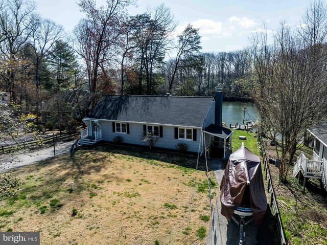 993 Hillendale Dr, Annapolis, MD 21409 - single story home featuring a water view, fence, a front yard, and roof with shingles