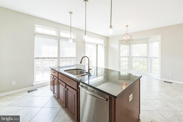 kitchen featuring visible vents, dishwasher, a sink, light tile patterned floors, and a notable chandelier