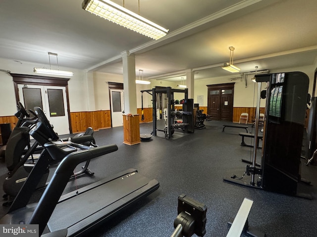 2853 Ontario Rd NW Unit 609, Washington, DC 20009 - exercise room with decorative columns, a wainscoted wall, wooden walls, and ornamental molding