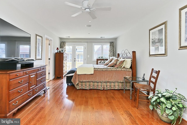 bedroom with french doors, access to exterior, and light wood-type flooring