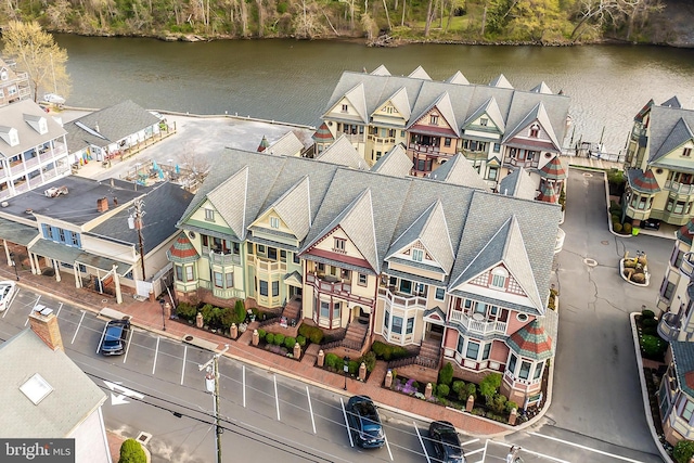birds eye view of property featuring a residential view and a water view