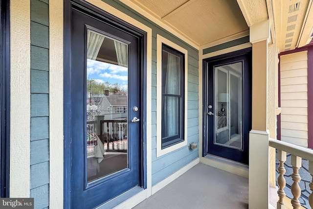 entrance to property featuring covered porch