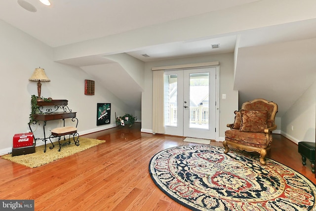 entryway featuring french doors, wood finished floors, baseboards, and visible vents