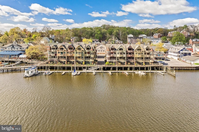 exterior space with a dock and a residential view