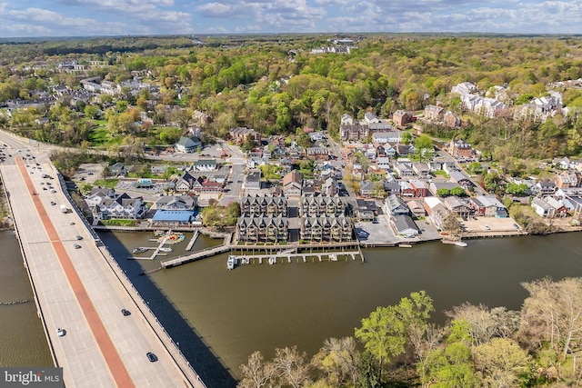 bird's eye view featuring a water view and a residential view