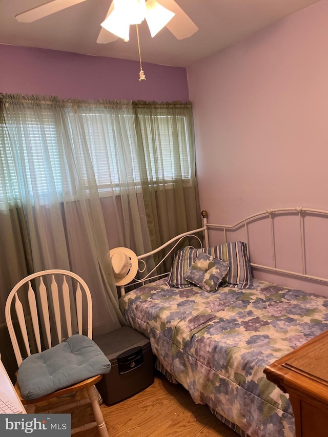 bedroom featuring ceiling fan and wood finished floors