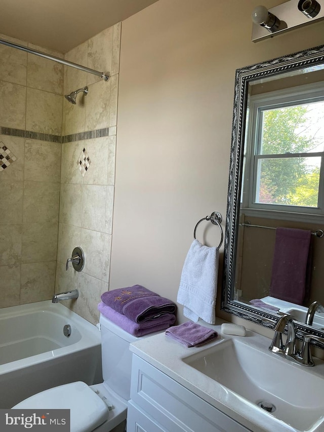 full bathroom featuring vanity, shower / bathing tub combination, and toilet