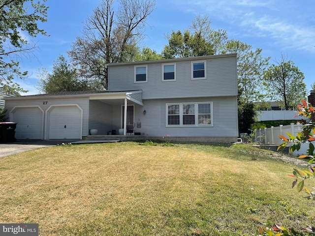 view of front of property featuring an attached garage, fence, driveway, and a front yard