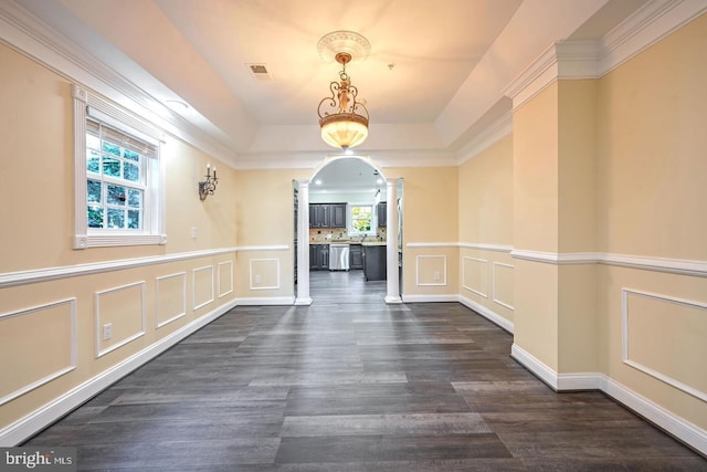 6411 L St, Capitol Heights, MD 20743 - hall featuring a decorative wall, arched walkways, dark wood finished floors, a raised ceiling, and wainscoting