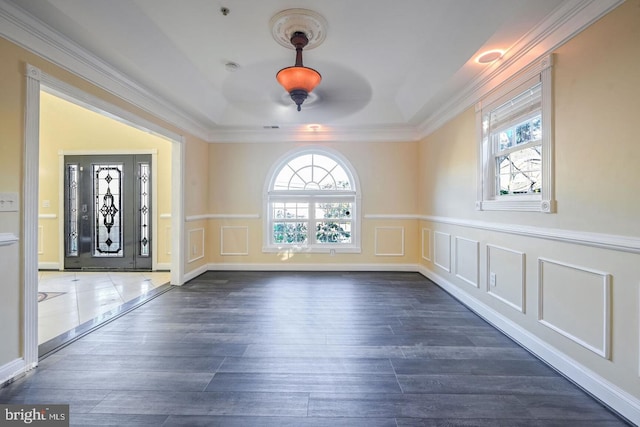 6411 L St, Capitol Heights, MD 20743 - entrance foyer with dark wood-type flooring, ornamental molding, a decorative wall, wainscoting, and ceiling fan
