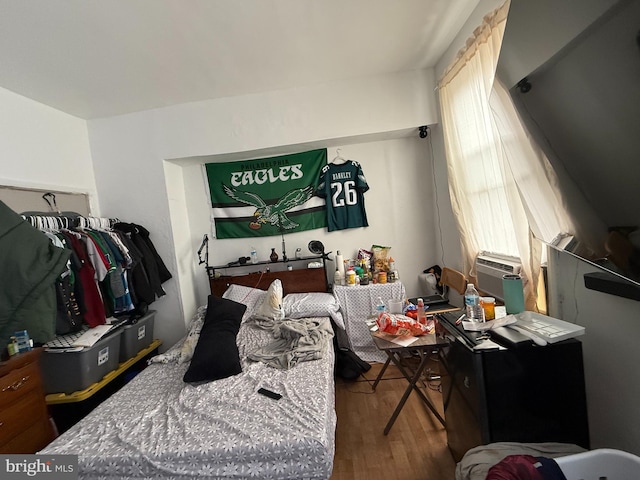bedroom with wood finished floors