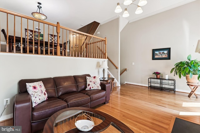 3814 Woodlawn Ct, Alexandria, VA 22304 - living room with stairway, baseboards, an inviting chandelier, and wood finished floors