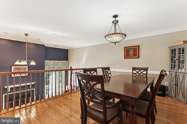 3814 Woodlawn Ct, Alexandria, VA 22304 - dining room featuring crown molding, hardwood / wood-style floors, and an inviting chandelier