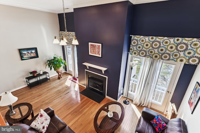 3814 Woodlawn Ct, Alexandria, VA 22304 - living area with crown molding, a fireplace with flush hearth, baseboards, and wood finished floors